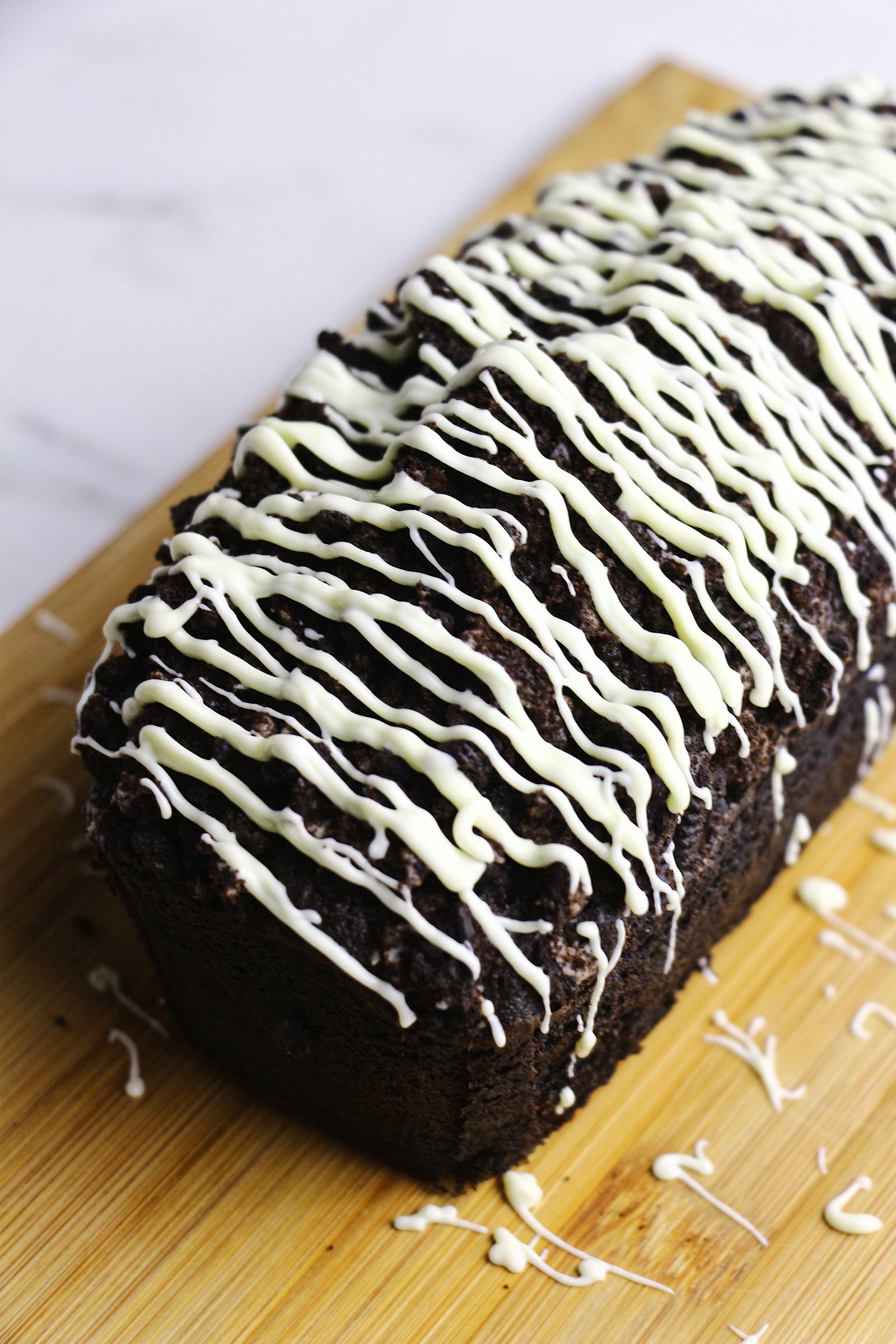 Midnight Madness | Black Cocoa Loaf Cakes w/ Oreo Crunch & White Chocolate Drizzle (makes 2x loaves)